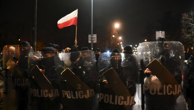 Pro-choice protesters clash with the police in Warsaw