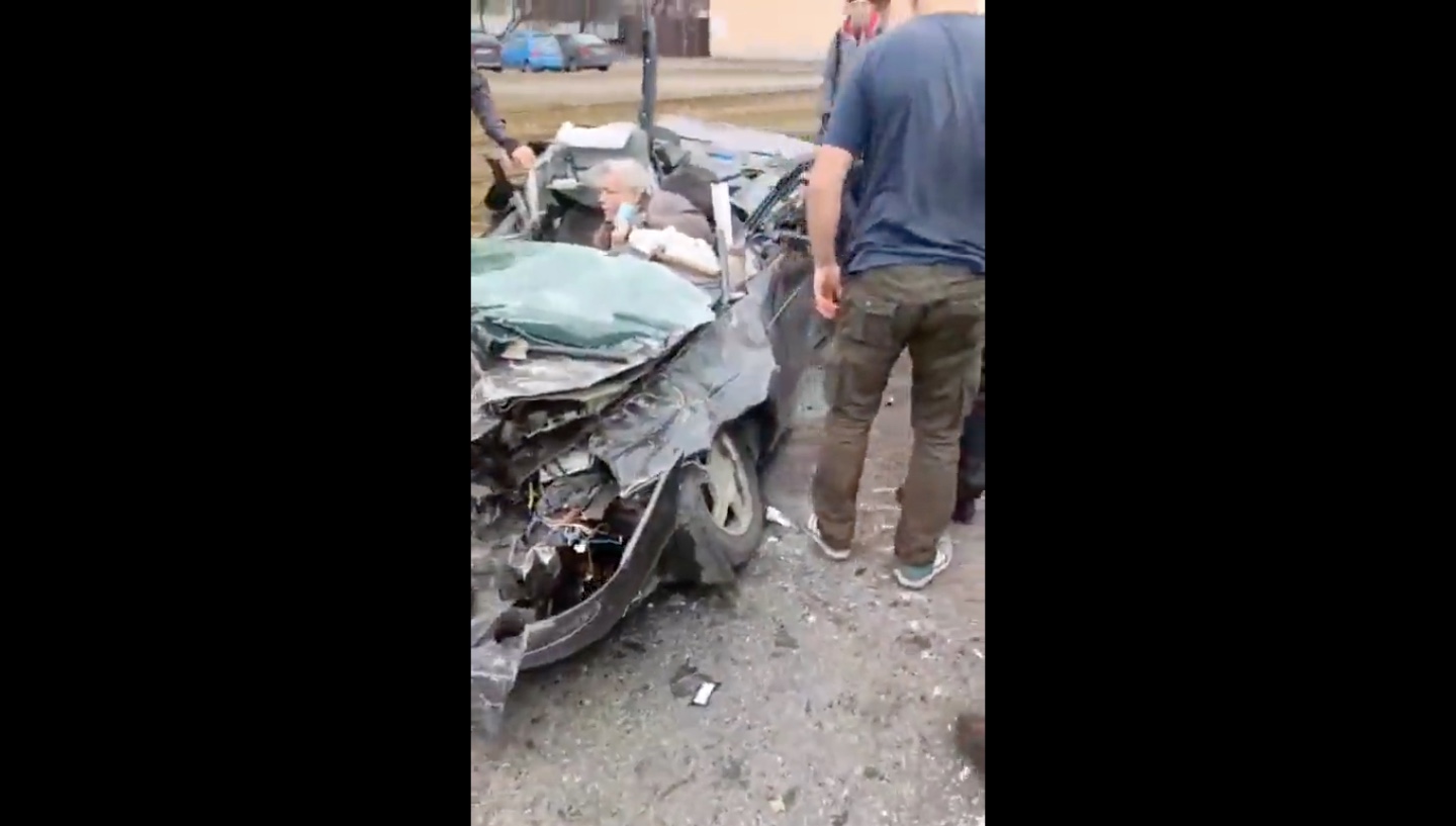 A Russian tank had driven over the civilian car. The driver survived! [VIDEO]