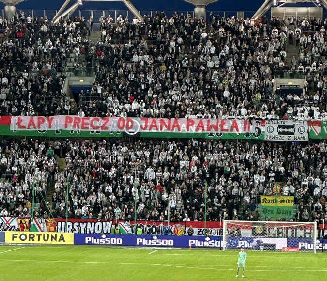 Polish football club fans warn those who attack the legacy of Pope John Paul II